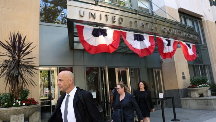 Paul Schmidt, an attorney representing Meta, and Meta’s defense team leave the federal courthouse where a trial over allegations that Meta designed Facebook and Instagram to be addictive to children takes place, in Oakland, California, U.S. | Manuel Orbegozo/Reuters