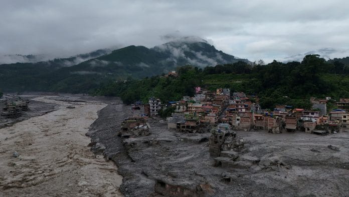 A drone view shows mud covering properties following a flash flood in Trishuli, Nuwakot district, Nepal. | Navesh Chitrakar/Reuters