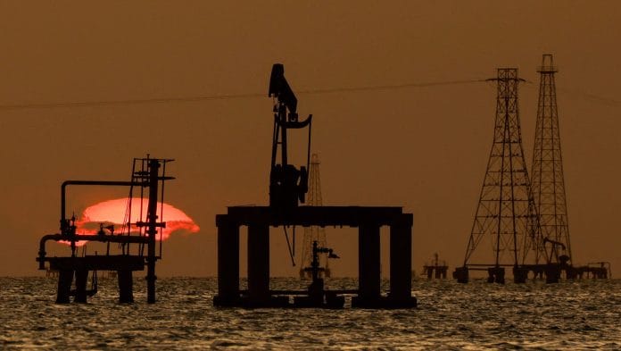 File photo of Oil platforms and pumpjacks at Lake Maracaibo, in Cabimas, Venezuela. | Leonardo Fernandez Viloria/Reuters