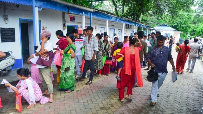 Residents queue up to submit their documents for the Special Intensive Revision (SIR) at a help camp set up by police on the premises of the New Jalpaiguri outpost police station, in Siliguri. | ANI