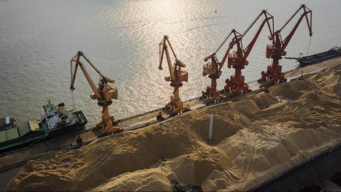 Piles of grain sit at a grain terminal at the Port of Nansha, operated by Guangzhou Port Group Co., in this aerial photograph taken in the Nansha district of Guangzhou, China, on Thursday, April 11, 2019. The U.S. is open to facing 