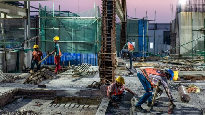 Construction workers in Kolkata, West Bengal, India. | Arko Datto/Bloomberg