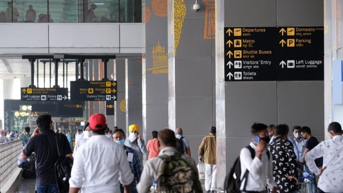 Travelers at Indira Gandhi International Airport in New Delhi, India, on Aug. 24, 2021. | T. Narayan/Bloomberg