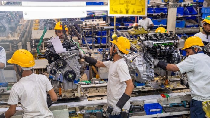 Workers assemble engines at a manufacturing plant in Hansalpur, India, on May 20. Photographer: Abeer Khan/Bloomberg representational Image