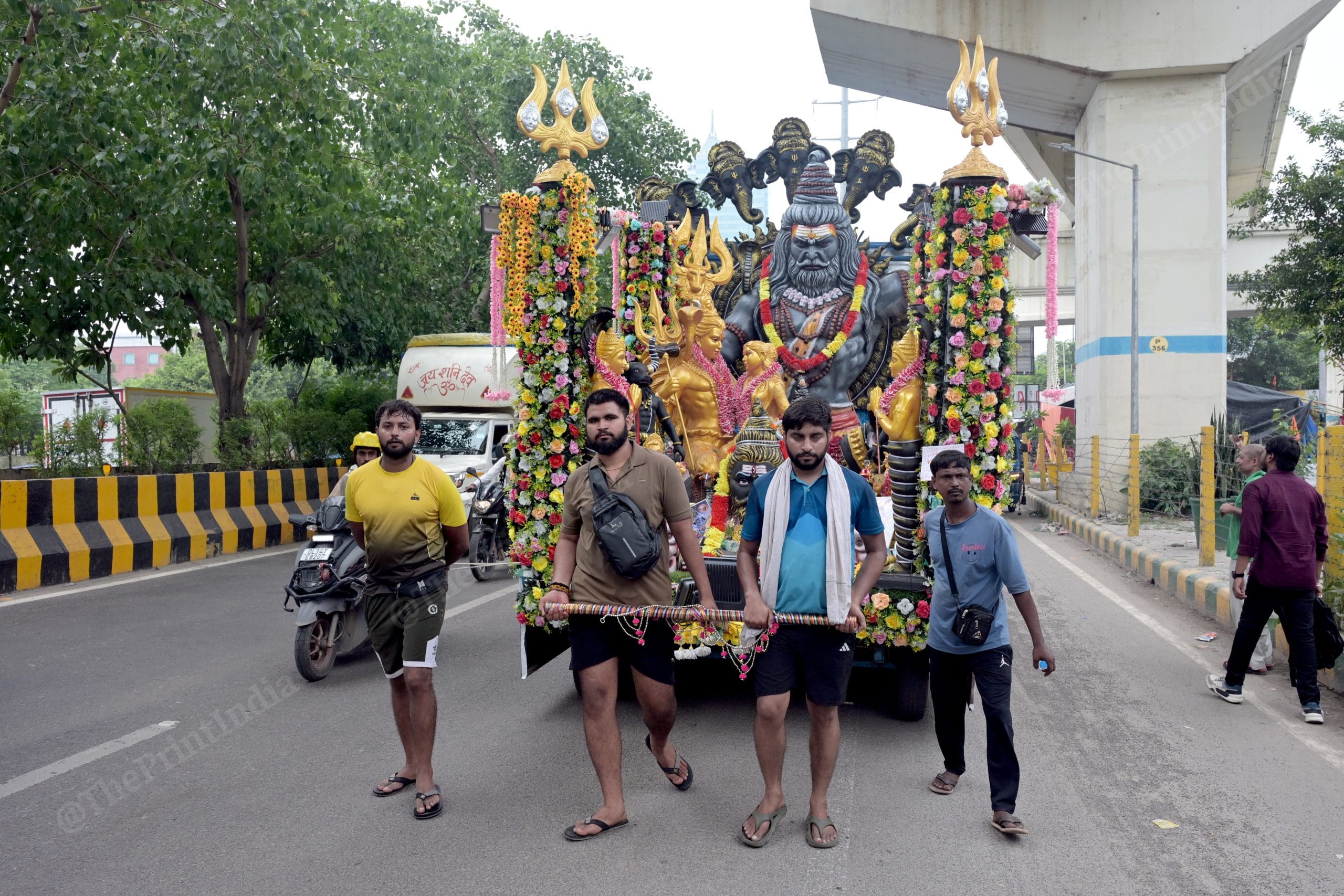 Kanwariya devotees seen carrying holy water from Haridwar during the annual Kanwar Yatra. | Suraj Singh Bisht/ThePrint
