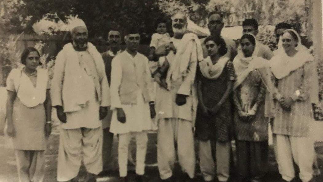 Left to right, is: Mridula Sarabhai; Abdul Samad Khan Achakzai; Bakshi Ghulam Mohammad; Jawaharlal Nehru; Khan Abdul Ghaffar Khan who is holding Rajiv Gandhi; Indira Gandhi; behind her, Sheikh Abdullah; an unidentified couple; B.P.L. Bedi; & Freda Bedi. | X/@_nehruvian