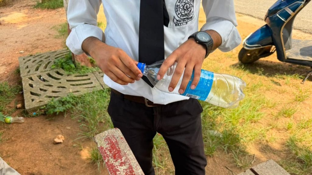 A student brings his own water as the university doesn't have proper drinking water facilities. Nootan Sharma | ThePrint