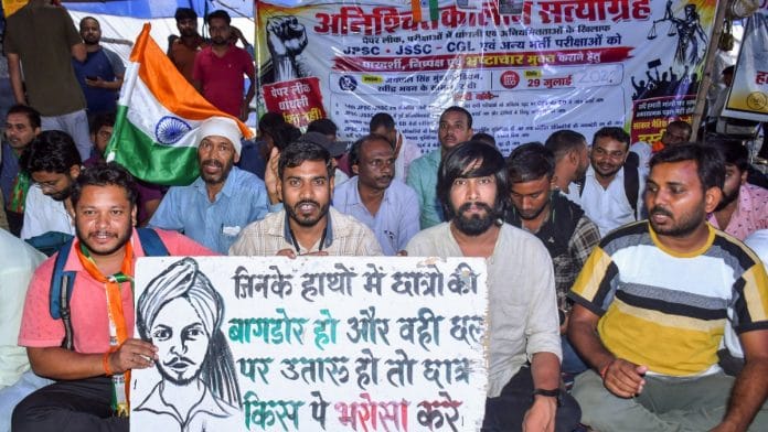 Students hold placards during protest against alleged JPSC exam paper leak at Jaipal Singh Stadium, in Ranchi on 9 August, 2026 | ANI