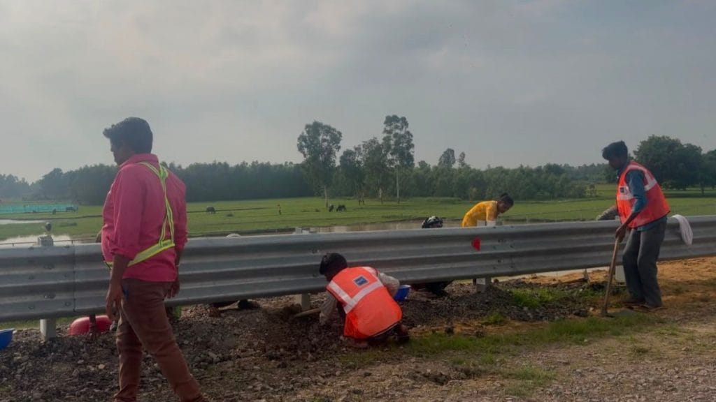 At multiple spots, the highway’s edge is also under construction with men and machines digging out a drainage channel. Saman Husain | ThePrint