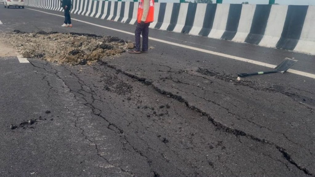 A worker stands near a damaged stretch on the Lucknow-Kanpur Expressway. Saman Husain | ThePrint