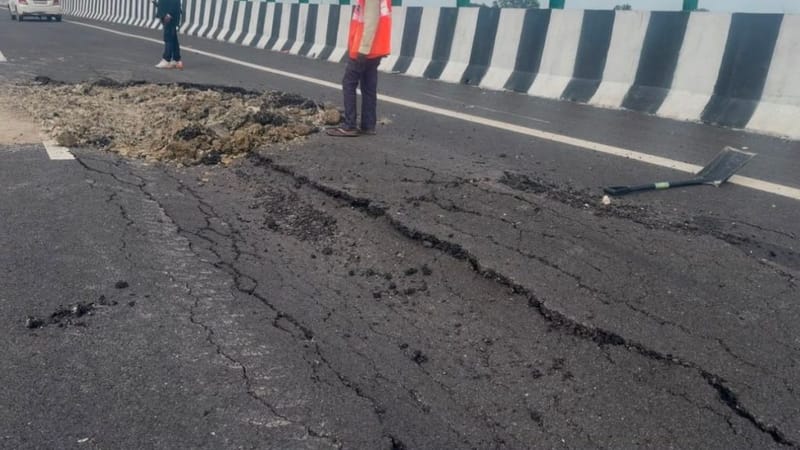 A worker stands near a damaged stretch on the Lucknow-Kanpur Expressway. Saman Husain | ThePrint