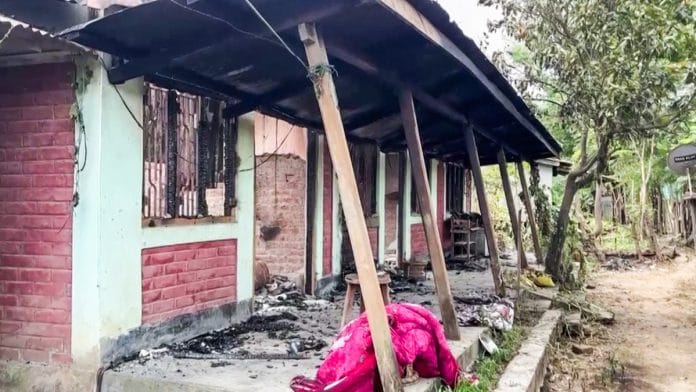 A house set ablaze during violence that broke out in and around Taphou, in Manipur's Senapati, on 24 August, 2026 | ANI
