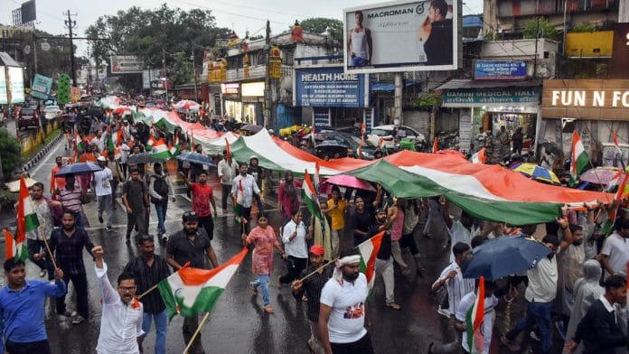Students hold the tricolour during a protest march against alleged exam irregularities in Ranchi Wednesday | ANI