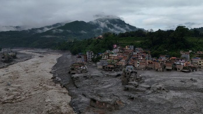 A drone view shows mud covering properties following a flash flood in Trishuli, Nuwakot district, Nepal, August 27, 2026. | REUTERS/Navesh Chitrakar