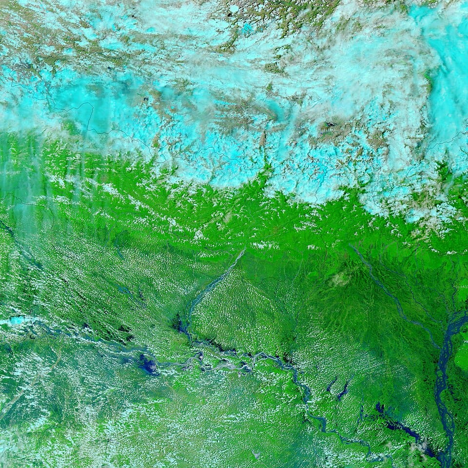 The braided channels of the Kosi River curve westward out of Nepal in a 'c' shape before flowing into the Ganga | MODIS Rapid Response Team at NASA GSFC | Wikimedia Commons
