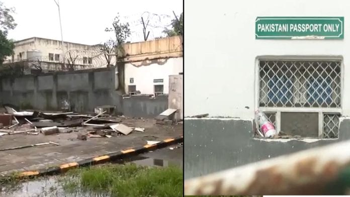 Indian authorities dismantle the external security perimeter outside the Pakistan High Commission, removing traffic bollards and barricades that previously ring-fenced the diplomatic compound. | Screengrab of ANI video