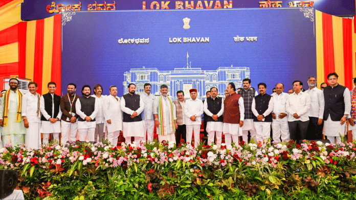 Karnataka CM Shivakumar in a group photograph with Governor Thaawarchand Gehlot and newly inducted ministers during Cabinet expansion ceremony on 3 August. | ANI