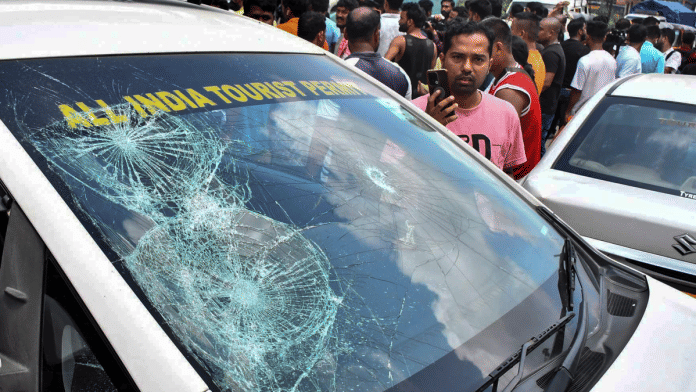 A vehicle with a shattered windshield during a protest by Assam taxi drivers at Jorabat along the Assam-Meghalaya border, on Thursday. The agitation was launched against the vandalism of Assam-registered vehicles and alleged assaults on drivers by Khasi Students' Union (KSU) activists in Shillong | PTI