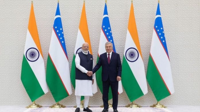 Prime Minister Narendra Modi with Uzbek President Shavkat Mirziyoyev in Tashkent | X