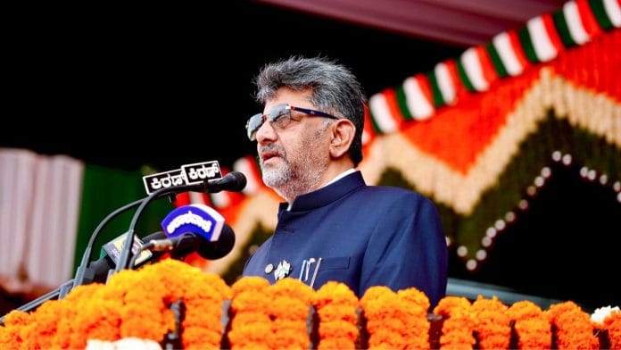Karnataka Chief Minister DK Shivakumar speaks after hoisting the national flag at the Parade Ground on the 80th Independence Day in Bengaluru | (@DKShivakumar X/ANI Photo)