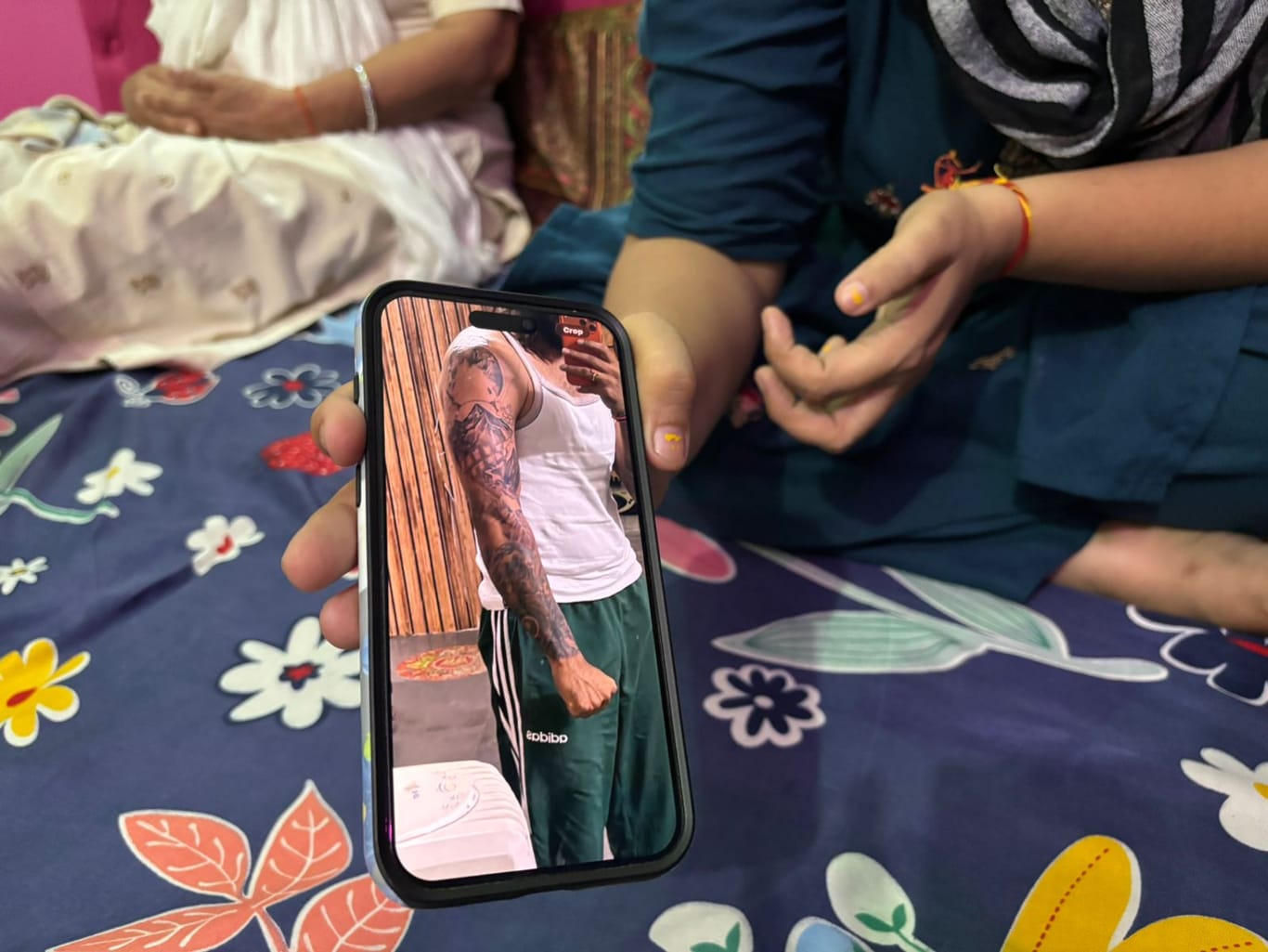 Ankit's wife Seema showing a picture of his tattoos; she says he had plans of getting a new one | Samridhi Tewari/ThePrint