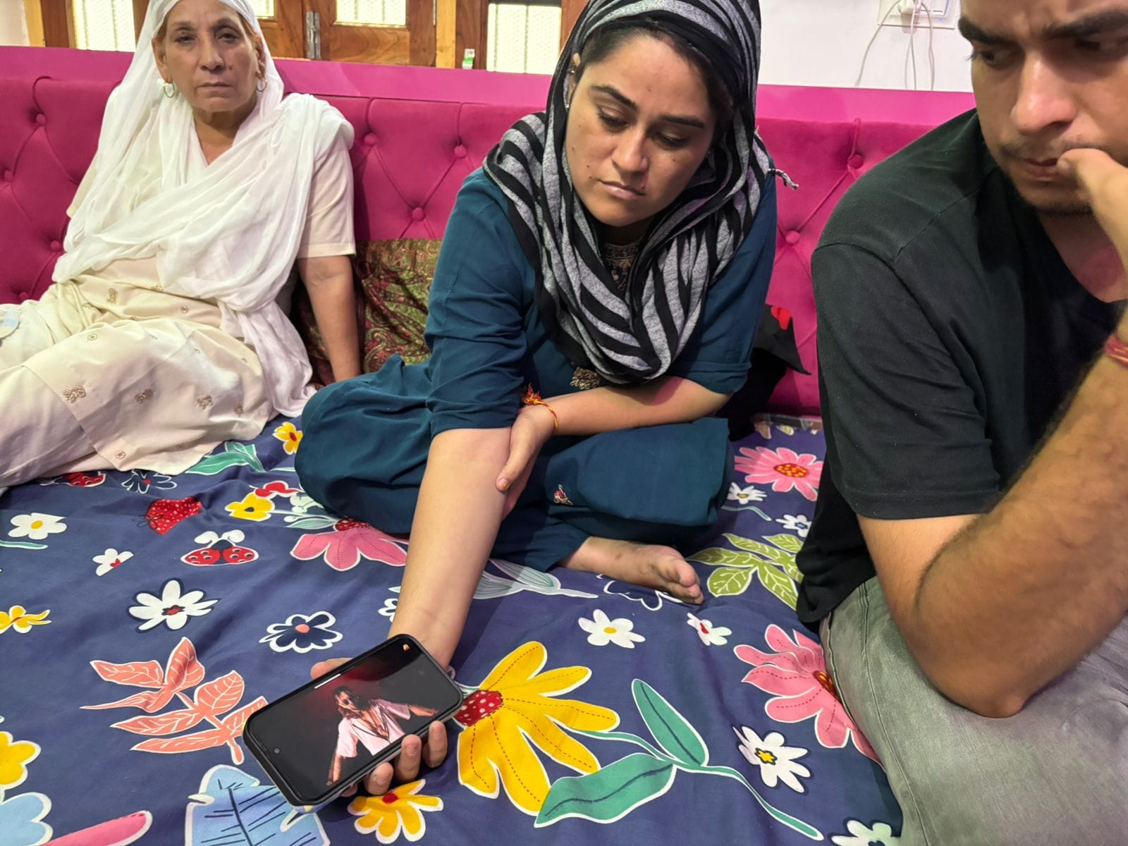 Ankit Baliyan’s wife Seema, a government school teacher in Delhi, showing one of her husband’s music videos | Samridhi Tewari/ThePrint