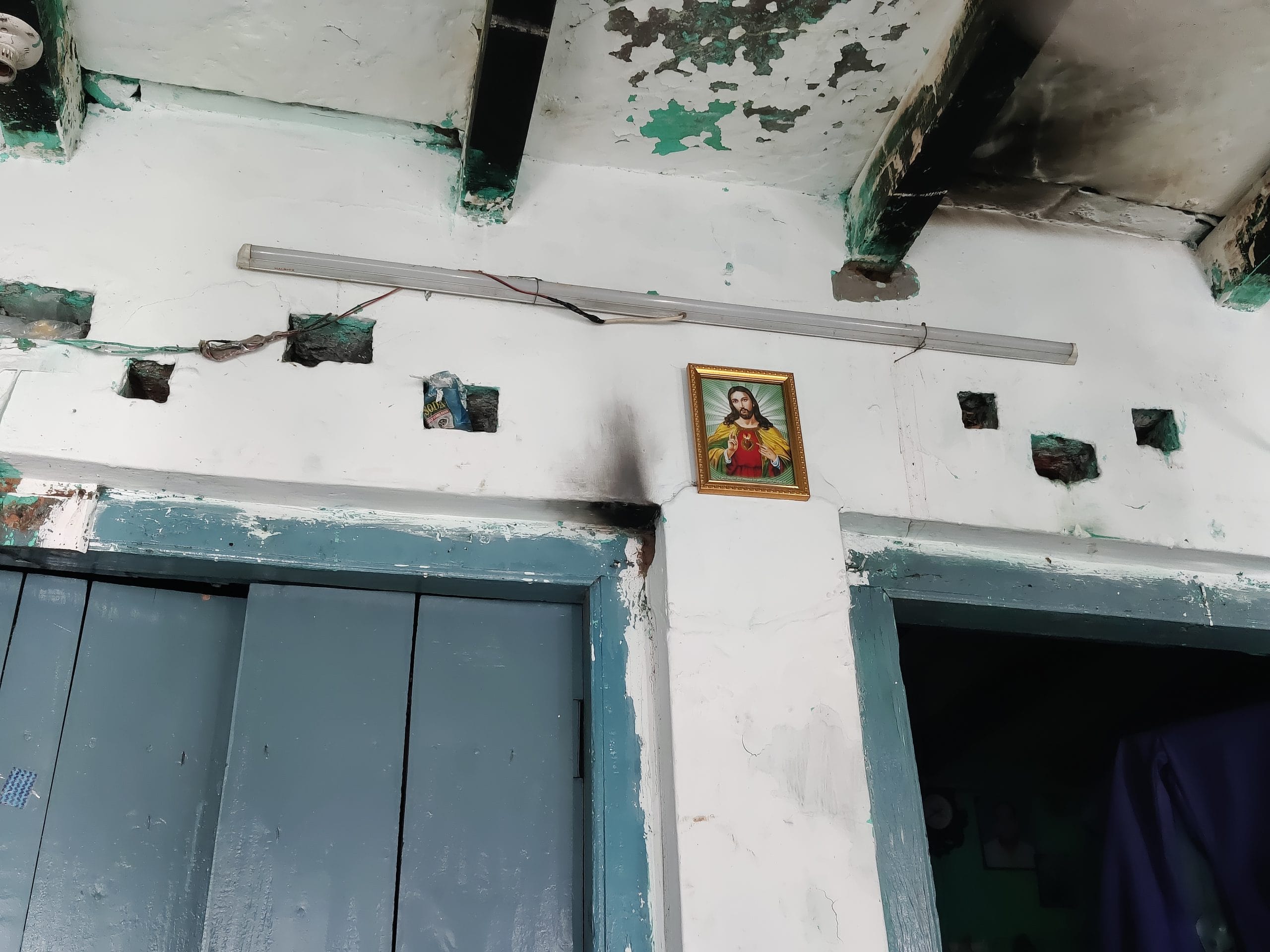A lone picture of Jesus Christ hangs on the wall of Satyawati’s home, a quiet marker of the faith she turned to after Ashok’s death, when the church became a source of comfort for her and her family| Vitasta Kaul, ThePrint