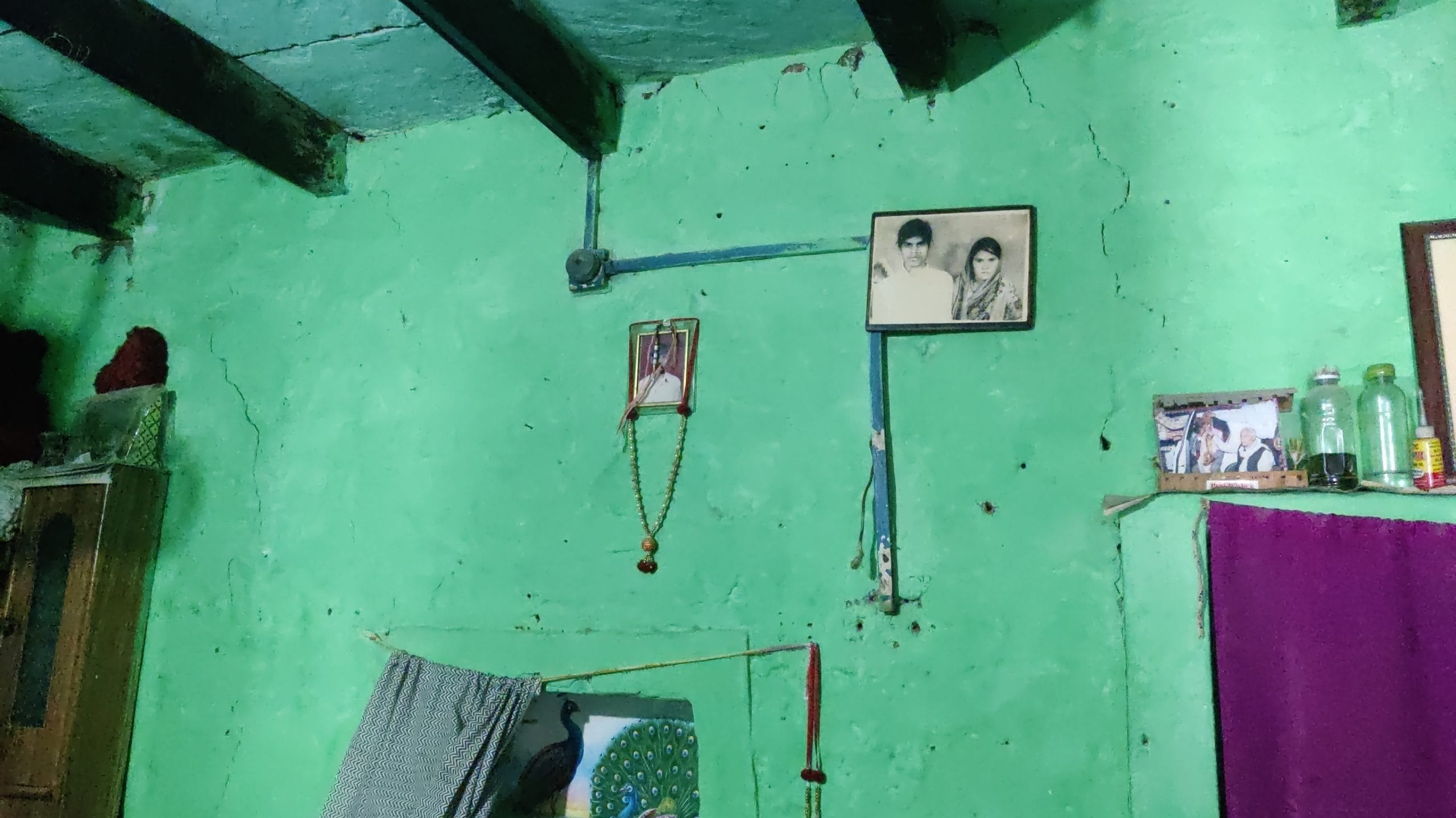 Inside Satyawati’s crumbling home, old family photographs hang alongside a picture of her brother-in-law | Vitasta Kaul, ThePrint