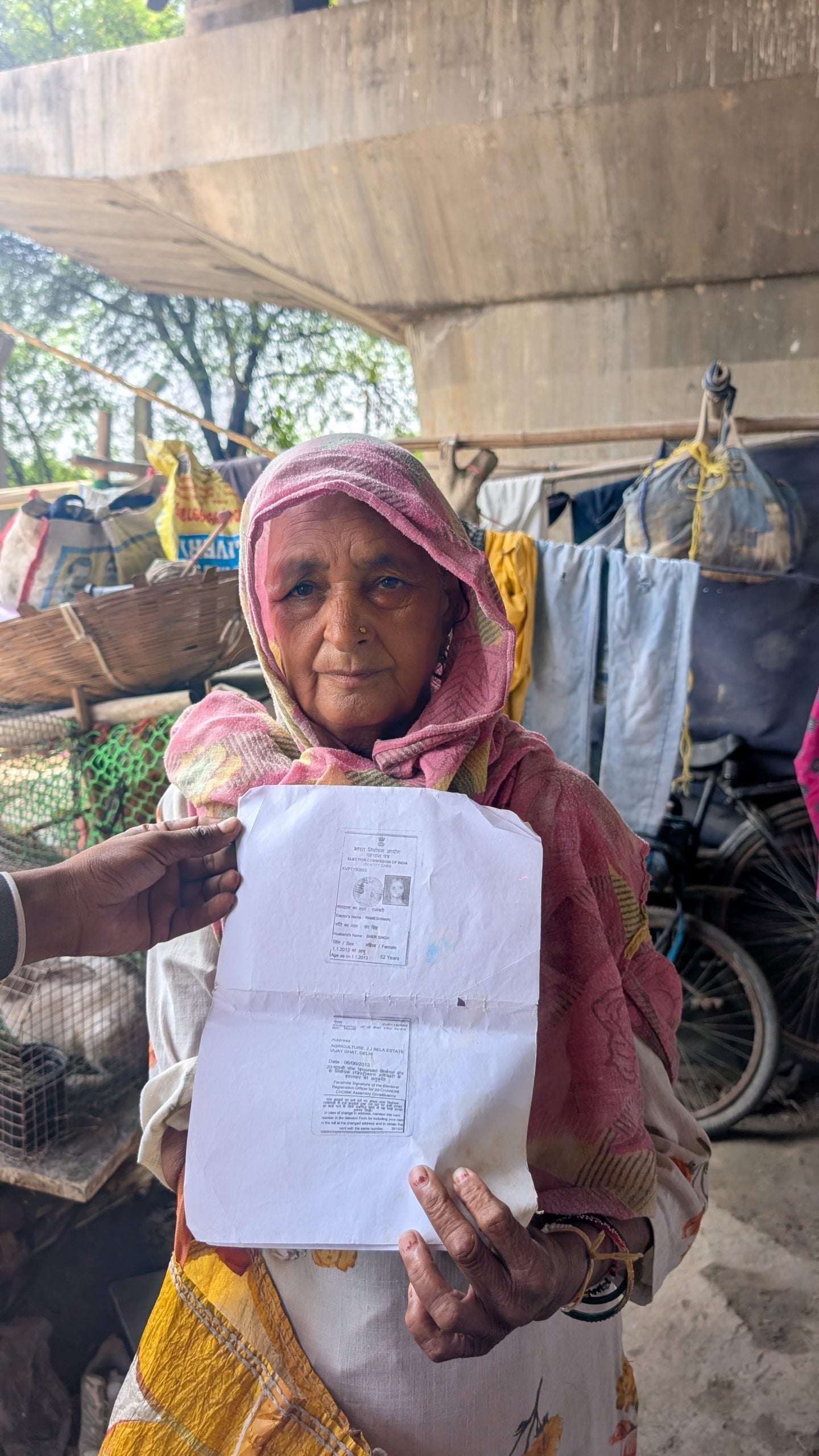 Rameshwari, 66, marked as “permanently shifted” in the ASDD list, with a photocopy of her ECI identity card | Apoorva Mandhani/ThePrint