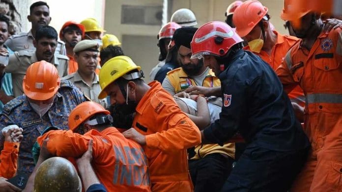 Rescue operations underway as a building collapses Satya Niketan in Delhi killing six. | Suraj Singh Bisht/ThePrint