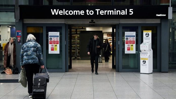 Members of the public arrive and depart at Terminal 5 of Heathrow Airport in London, Britain. | Alishia Abodunde/Reuters