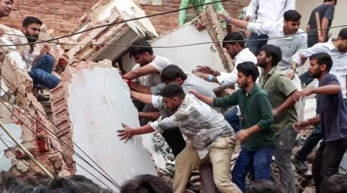 Rescue operation underway after a building collapsed in Satya Niketan area in south Delhi Sunday | ANI Video Grab