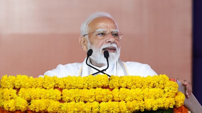 Prime Minister Narendra Modi addresses a gathering during a public programme, in Navsari on Tuesday. | ANI