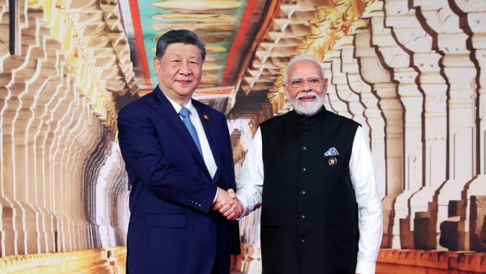 Prime Minister Narendra Modi and Chinese President Xi Jinping exchange a handshake during the 18th BRICS Summit 2026 at Bharat Mandapam, in New Delhi on Saturday. | ANI