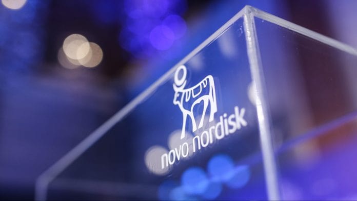 The Novo Nordisk A/S logo during a news conference in Mumbai, India, on Tuesday, June 24, 2025. Novo Nordisk said it will sell its blockbuster weight-loss treatment Wegovy in India starting at $50 a week, tailoring the price to match the pocket of consumers in a nation with the worlds third-largest obese population. | Dhiraj Singh/Bloomberg