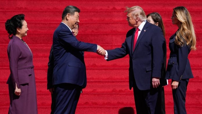 Xi Jinping shakes hands with Donald Trump in Washington, DC, on Sept. 25. Photographer: Daniel Heuer/Bloomberg