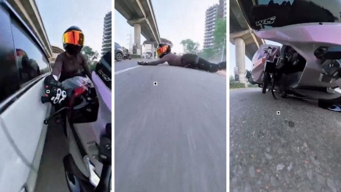 The car approached at high speed, hitting the woman's sports bike in Gurgaon. She falls to the ground, while her vehicle is dragged several metres | Screengrab from video