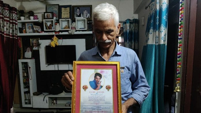 Ashok Rana, Harish’s father, holds a commemorative plaque presented by AIIMS, recognising the family’s strength and their role in achieving a significant medical and legal milestone | Vitasta Kaul, ThePrint