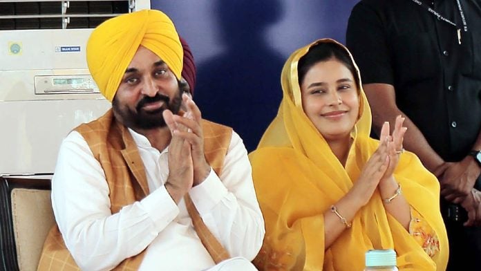 File photo of Punjab CM Bhagwant Mann and wife Dr Gurpreet Kaur at Government Girls College in Patiala on 24 April, 2023 | ANI