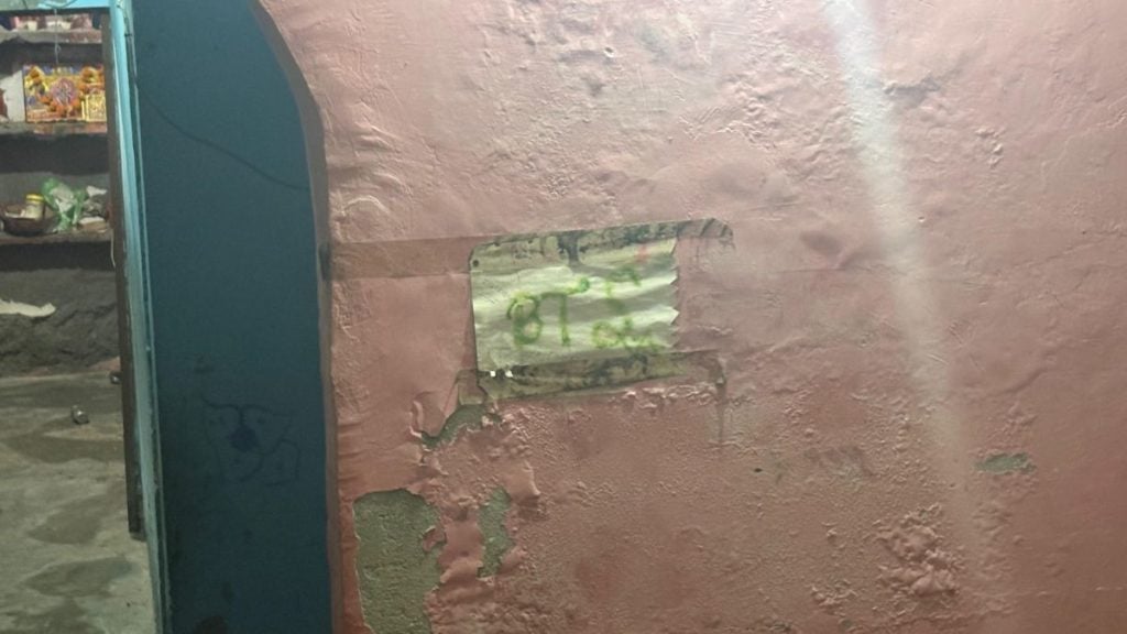 The teenager was a BTS fan. Her father shows a drawing of a sign by her daughter pasted on the wall. Sakshi Mehra | ThePrint