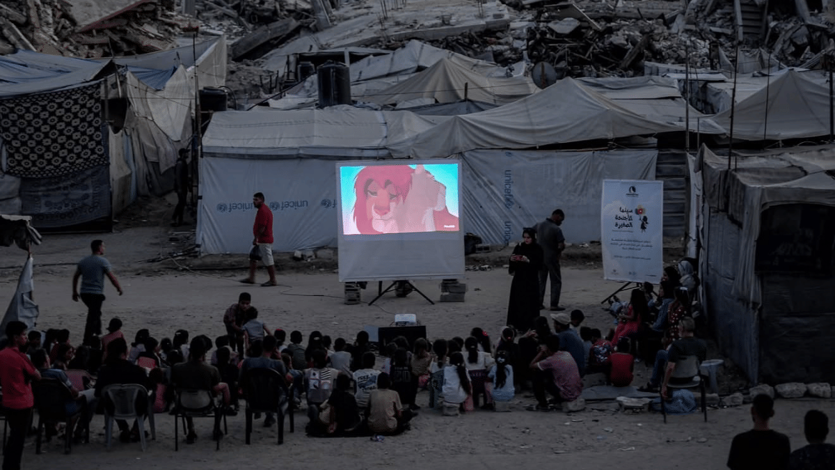 Disney magic in Gaza. Children gather to watch The Lion King amid rubble