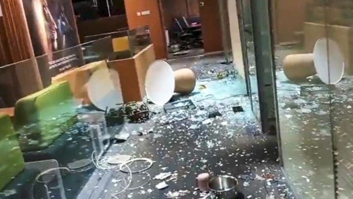 A screengrab from a video shared by TMC leader Abhishek Banerjee shows shattered glass on the floor after an intrusion at his Camac Street office. (@abhishekaitc/X via PTI Photo)