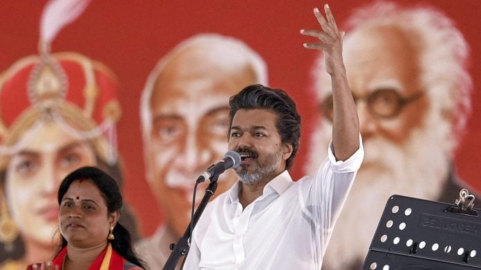 Madurantakam: Tamil Nadu Chief Minister and Tamilaga Vettri Kazhagam (TVK) president C Joseph Vijay addresses an election campaign meeting alongside party candidate K Maragatham Kumaravel, left, during an election campaign ahead of the Madurantakam Assembly by-election, in Chengalpattu district, Friday, Sept. 25, 2026. (PTI Photo)(PTI09_25_2026_000455B)