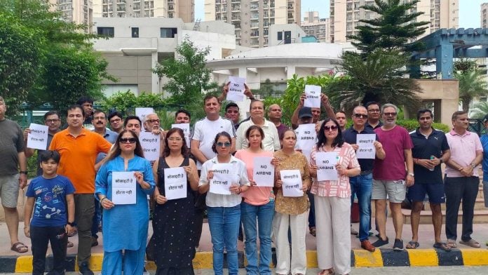 Residents of Windsor Park Society in Vaibhav Khand, Ghaziabad, protested against alleged Airbnb-style short-term rentals operating inside the society flats | By special arrangement