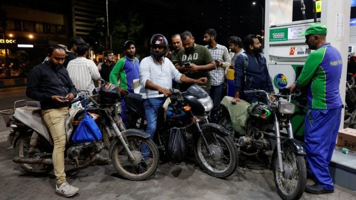 People wait to refuel their motorcycles at a petrol station in Karachi, Pakistan 0n 17 September, 2026 | Akhtar Soomro/Reuters
