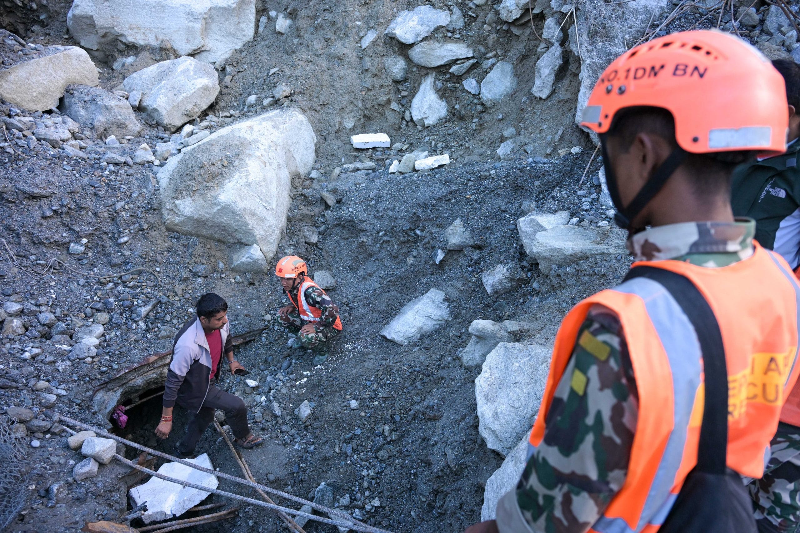 Bharat Raj Bisht searches for his elder brother, who worked as a supervisor at the Upper Trishuli 3-A Hydropower Tunnel. He searched the areas around the tunnel with the help of the Nepal Army. | Suraj Singh Bisht