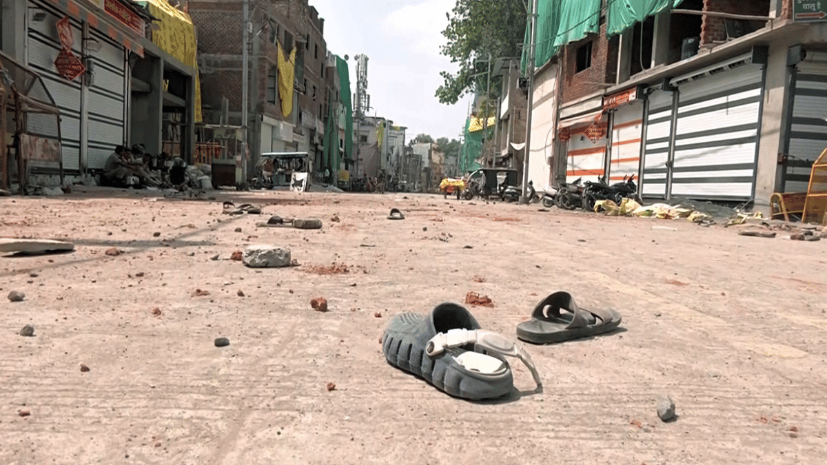 Stones lie scattered on a deserted street following clashes on Monday over proposed partial demolition of 'Shahi Masjid'. | ANI