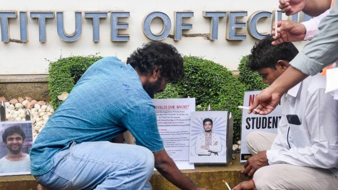 Demonstrators stage a candlelight protest in Mumbai on Monday to pay tribute to the suicide victims of IIT Bombay | PTI Photo
