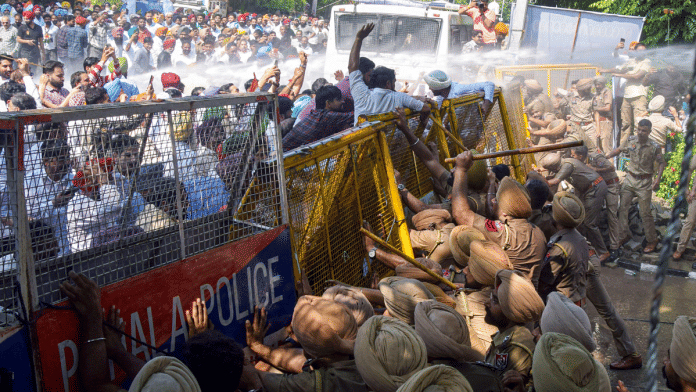 Police use a water cannon to disperse protesting Congress leaders and workers, as they attempt to break through barricades outside the PSPCL office over power-related issues in Patiala | ANI File