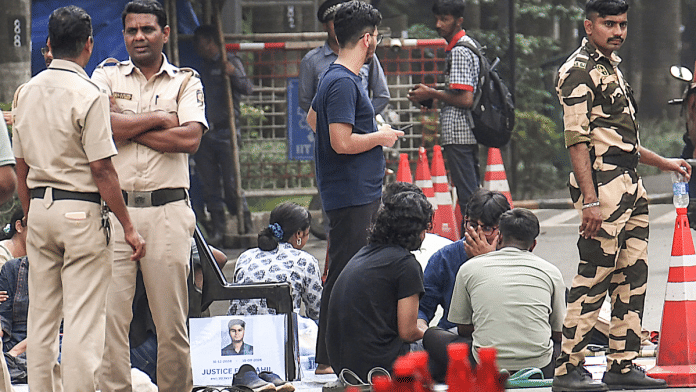 Security personnel stand guard as students stage after a 22-year-old IIT-Bombay student died by suicide in his hostel room, in Mumbai | PTI